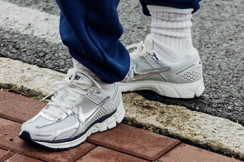 a pair of metallic Nike sneakers