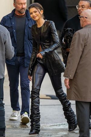 a paparazzi photo of zendaya wearing an all black leather outfit walking on the street